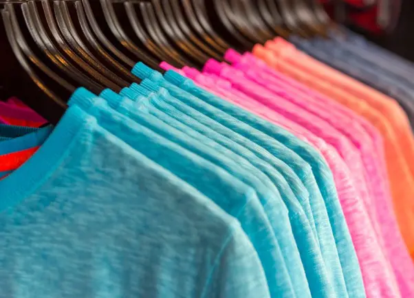 Row of Colored T-shirts in a Store